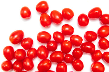 Obraz premium Red cherry tomatoes on a white background