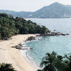 Beautiful view at empty exotic beach with jungle, rocks and  blue sea. Travel, summer and vacation...