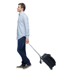 back view of walking  business man  with suitcase.