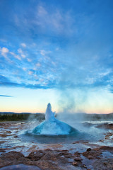 Strokkur Geysir Eruption with Bright Blue Sky, Iceland