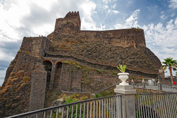The castle perched on a spur of rock on the sea of ​​Aci Castello in Sicily, Italy.