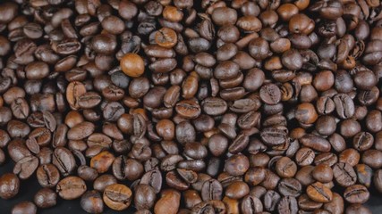 Roasted coffee beans background. Aromatic roasted coffee close up
