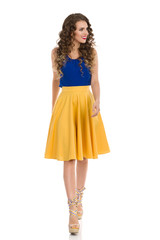 Smiling Beautiful Woman Is Walking Towards Camera And Looking Away