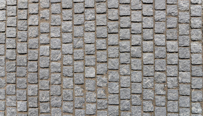 Old cobblestone pavement close-up.