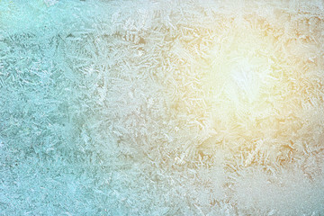 Frost And Sunset on glass in winter. Pattern ice on window