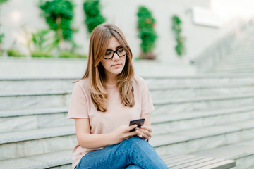 woman using phone outdoors