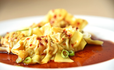 Steamed pork & prawn wontons with black sweet chili sauce