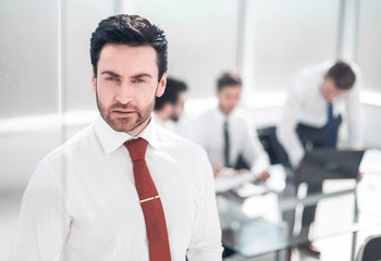 close up.serious businessman standing in the office.
