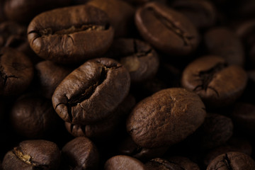 roasted coffee beans background close up. macro shot