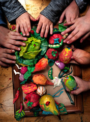 Hands of creative . Children's hands and crafts from soft modelling clay in a creative workshop 