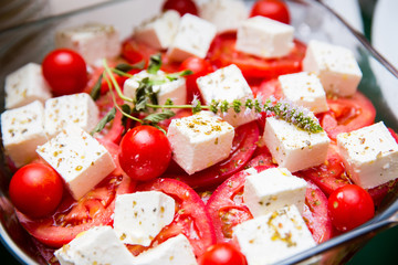 a bowl of fresh summer tomato and cheese salad