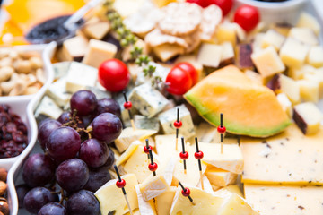 bites of fresh fruit, cheese and nuts