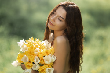 Woman with Bouquet of the Spring Flowers Outdoors