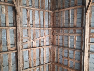 traditional wooden roof framework seen from below