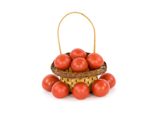 Tomatoes in a basket on a white background