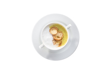 Fresh homemade vegetable soup with green peas and croutons in white bowl isolated on white background