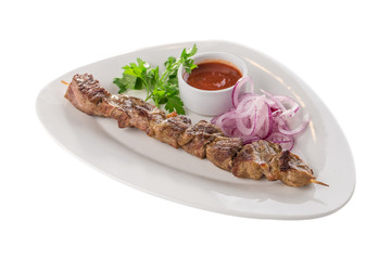 grilled meat lamb shish kebab with red onion and parsley isolated on white background