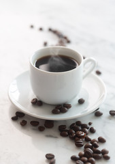 Hot cup of espresso coffee on a table