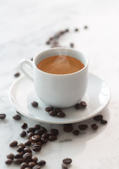 Hot cup of espresso coffee on a table