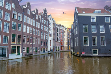 Traditional houses in Amsterdam in the Netherlands at sunset