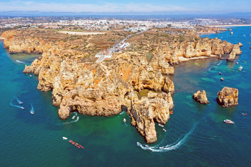 Aerial from natural rocks and the lighthouse at Ponte Piedade in Lagos Portugal
