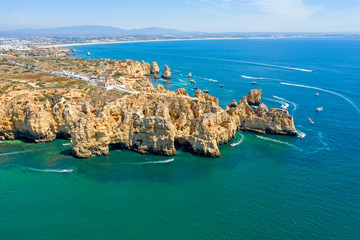 Aerial from natural rocks and the lighthouse at Ponte Piedade in Lagos Portugal