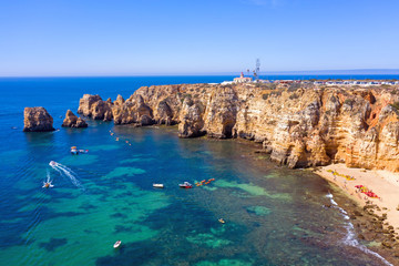 Aerial from natural rocks and the lighthouse at Ponte Piedade in Lagos Portugal