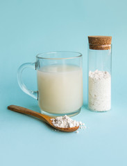 Diatomaceous earth also known as diatomite mixed in glass of water, good for human body detox concept.