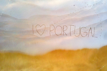 I love Portugal written in the sand at the beach