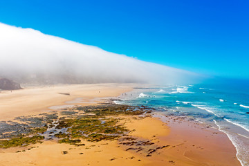 Aerial from sea fog at the atlantic ocean in Portugal