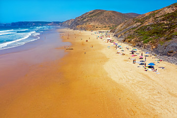 Aerial from Vale Figueiras beach on a beautiful summer day in Portugal