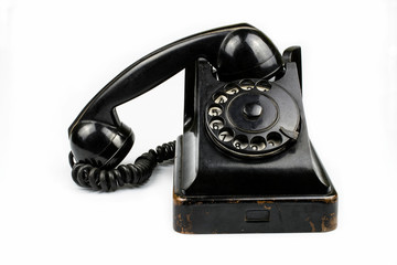 Old telephone with the taken off receiver isolated on a white background.