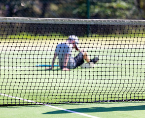 boy defeated on tennis court