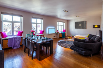 Modern interior of living room with furniture and tv.