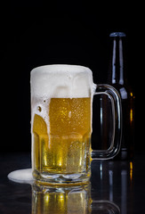 Glass of Cold Beer on a Black Background