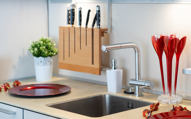 Modern interior of stylish kitchen. Sweets and plates.