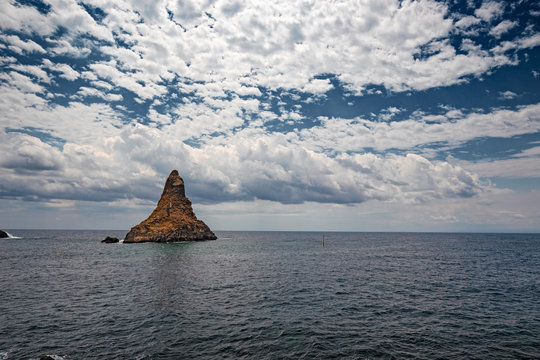 Panoramic view of the rocks and the Ciclopi islands in Aci Trezza in Sicily, Italy.