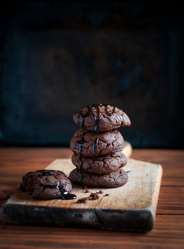 Homemade chocolate cookies on wooden background