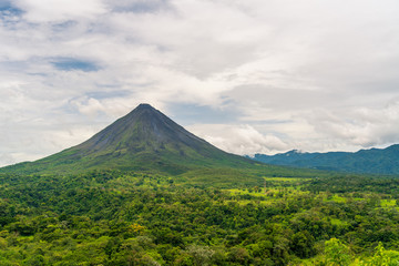Fototapeta na wymiar Arenal Volcano, which has an almost perfect cone shape, is one of the biggest tourist attraction in Alajuela, Costa Rica