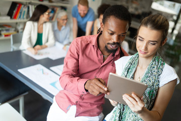 Group of business people collaborating on project in office