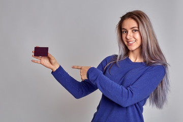 Naklejka premium Happy young girl rejoices life. The girl rejoices and smiles having reached the goal.