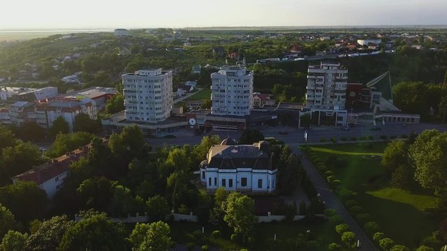 Aerial view of Slatina city and river Olt, Romania. Drone flight over the european city in summer day.