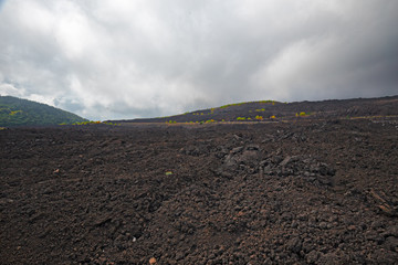 Closeup of the lava of the Etna volcano on a foggy day, in Sicily, Italy.