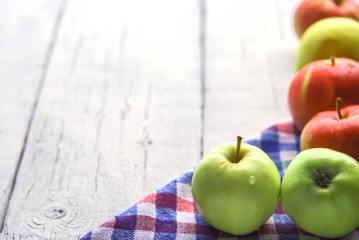 .apple background. On a white wooden table. In a rustic style. Books