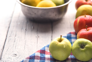 .apple background. On a white wooden table. In a rustic style. Books