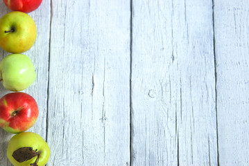 .apple background. On a white wooden table. In a rustic style. Books