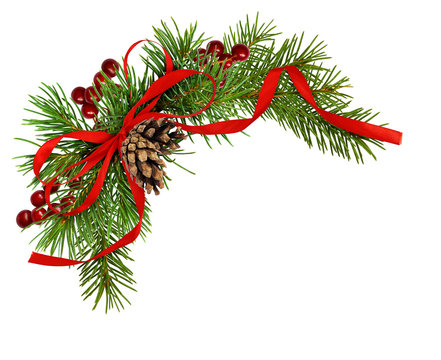 Christmas arrangement with pine twigs, cones, berries and red silk ribbon bow
