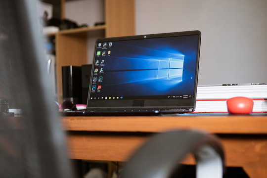 Bangkok, Thailand - July 9, 2019 : Laptop computer showing its screen with Microsoft Windows logo on desktop.