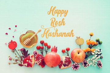 Fototapeta na wymiar religion image of Rosh hashanah (jewish New Year holiday) concept. Traditional symbols over wooden mint blue pastel background