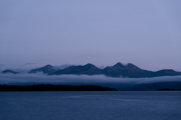 Landscape of mountains coming out from the sea in Molde, a beautiful view from of the fjord.